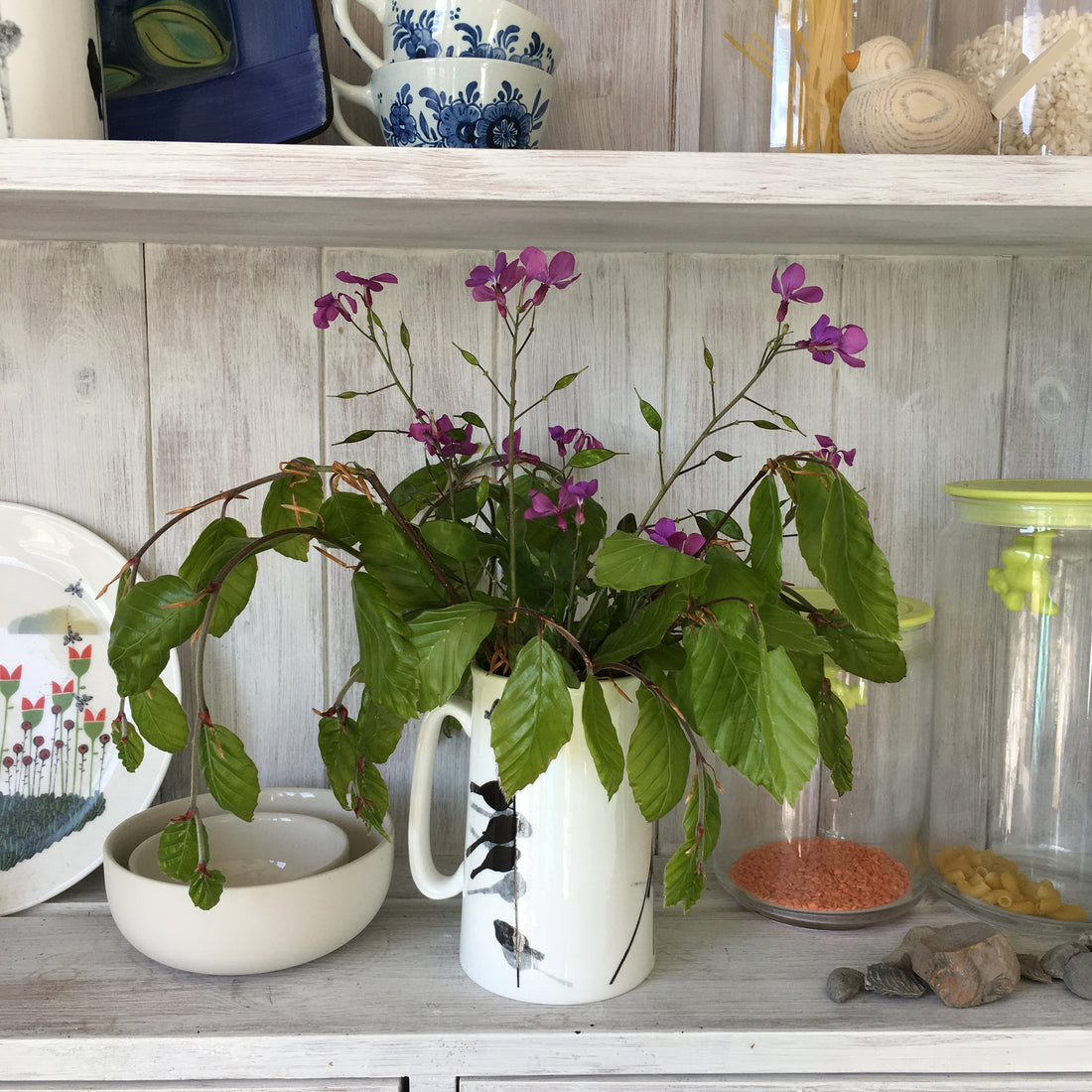 Foraged jugs of flowers